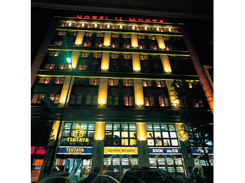 Hotel facade at night.