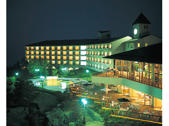 Hotel facade at night.